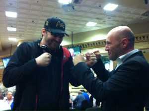 Phil Hellmuth who started the GPI Debate on Twitter is seen in a comic fist fight with GPI CEO Alexandre Dreyfus
